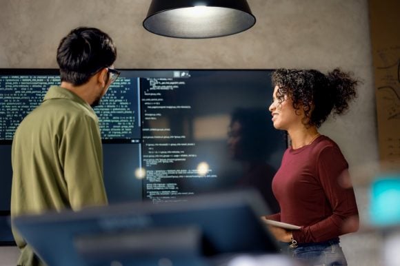 Software engineers discussing project