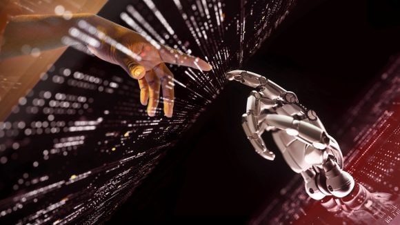 Human hand touching robotic hand