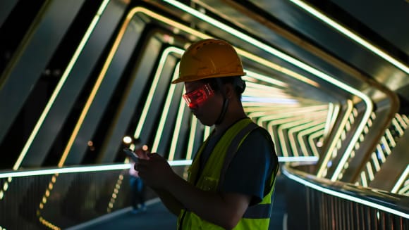 Man on neon stairs