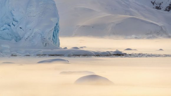 Iceberg in snowy landscape