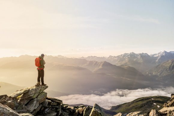 Hiker standing on hilltop