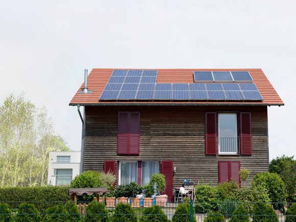 Old wooden house with purple shutters