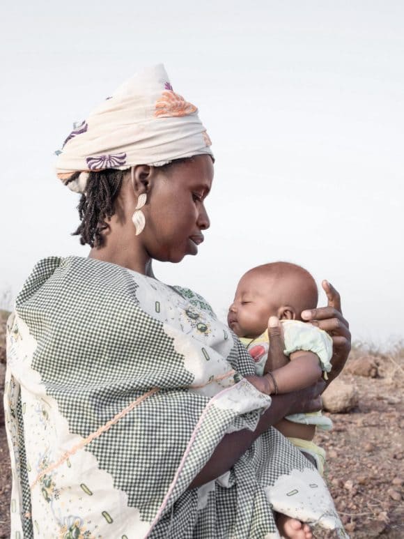 A mother in Africa hugs her baby 