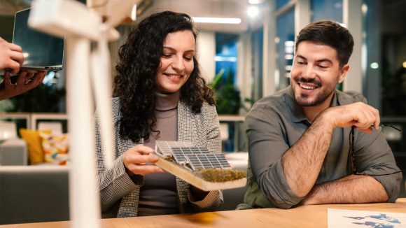 Couple sitting inside a train's window