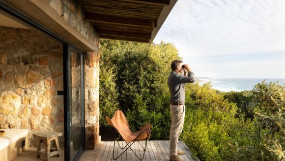 Man looking through binoculars