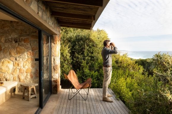 Man looking through binoculars