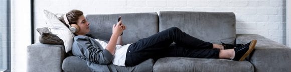 Guy Sitting on Sofa