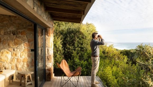 Man looking through binoculars