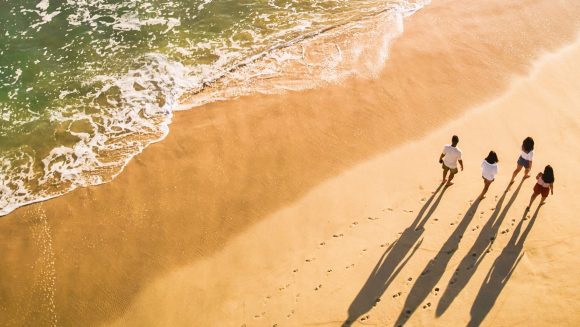 Fmaily walking on beach