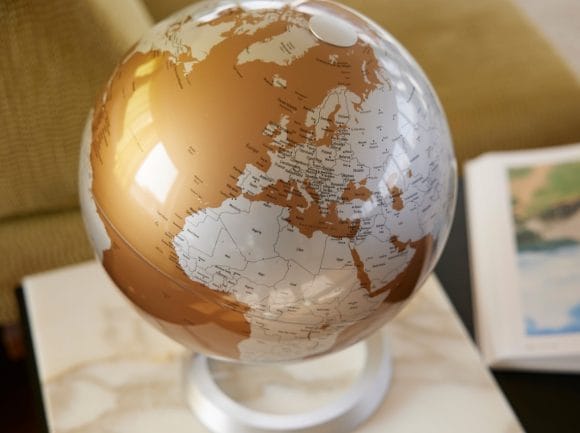 Globe and book on marble table