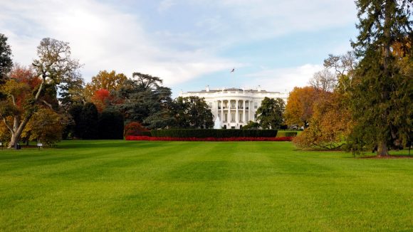 View of the White House lawn with trees in fall colors