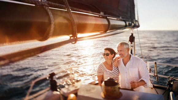 Senior couple on sailing boat