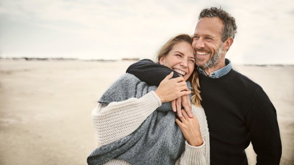Couple standing on a beach
