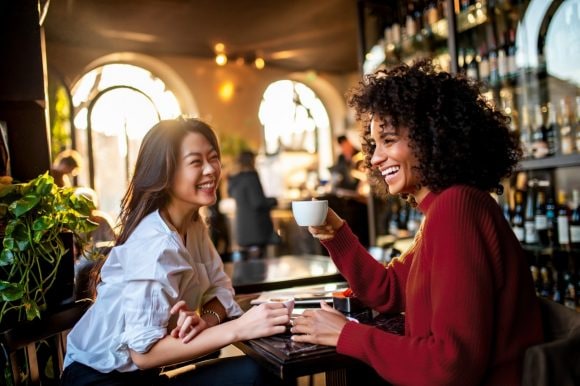 Two friends having coffee