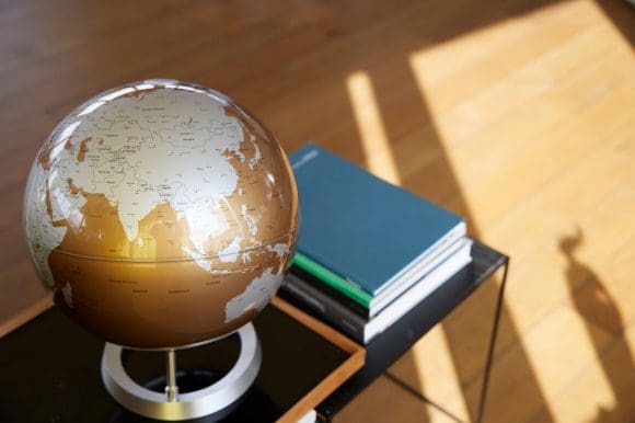 Globe and books on desk