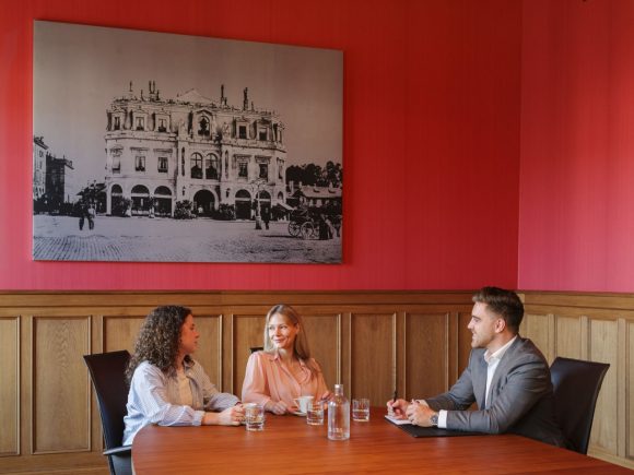 Three people having meeting in conference room at UBS Bubenbergplatz 3, Berne