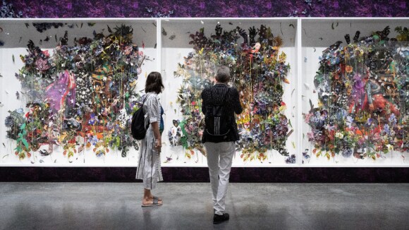 People observing art