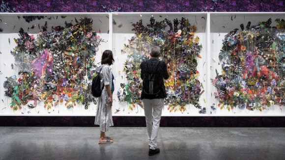 People observing art