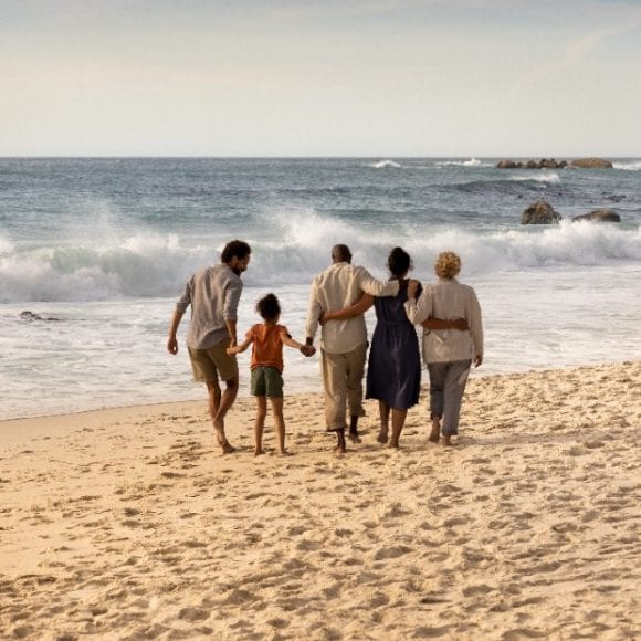 Family walking on beach