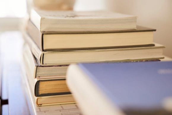 Pile of books on shelf