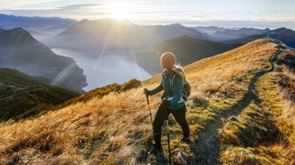 Woman hiking along mountain ridge