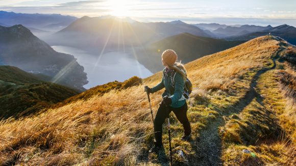 Woman hiking along mountain ridge