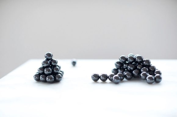 Magnetic balls in random forms on a table