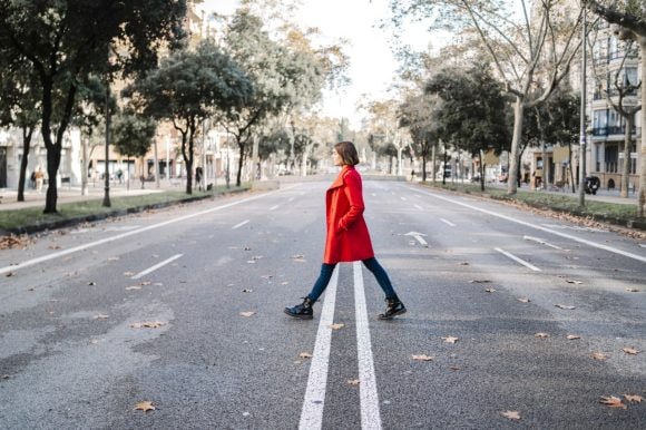 Image of a women crossing road