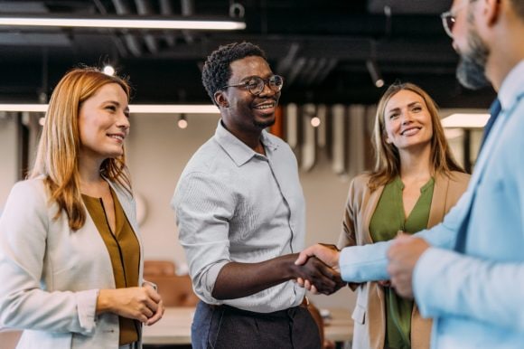Stakeholders shaking hands standing