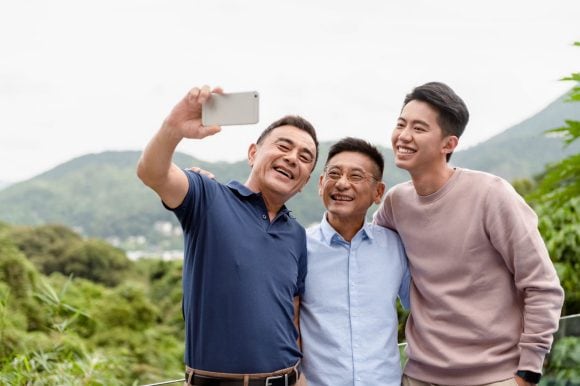 Three asians taking a selfie together