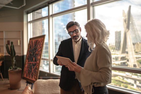 Business partners using digital tablet