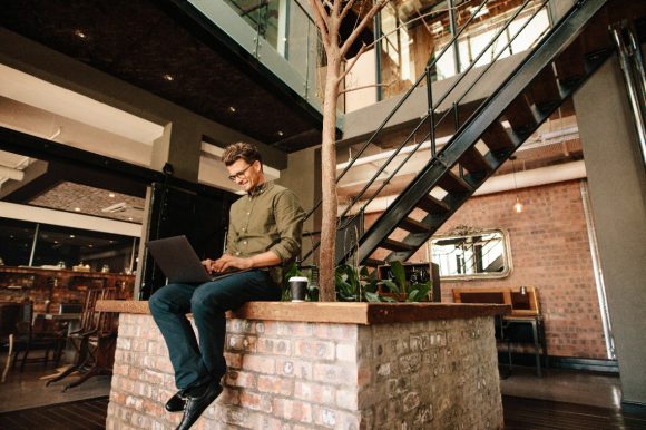 Man sitting on a wall