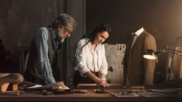 Tailors working in studio on suit