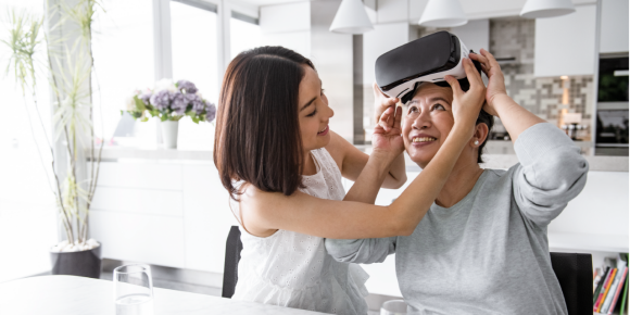 woman trying out a virtual reality headset
