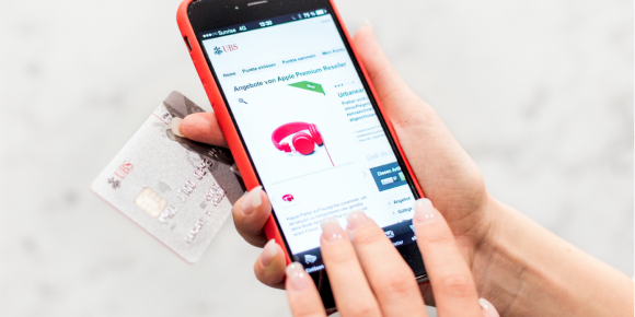 person buying something on their mobile phone