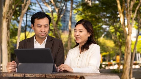 Collegues with tablet computer