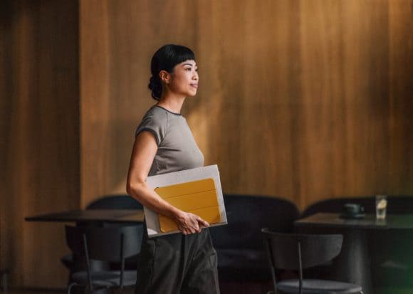 Asian woman with notebook