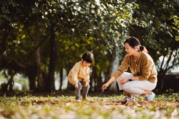 Mother and daughter in park