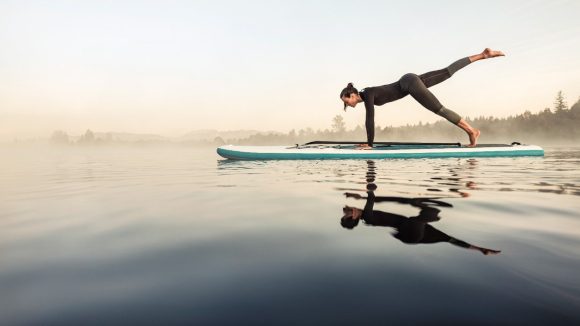 Women yoga surf board