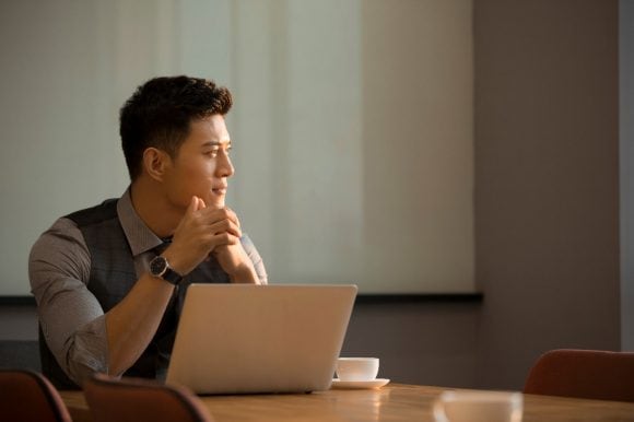 Man working on a laptop.