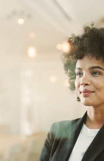 Woman looking confidently across a board room