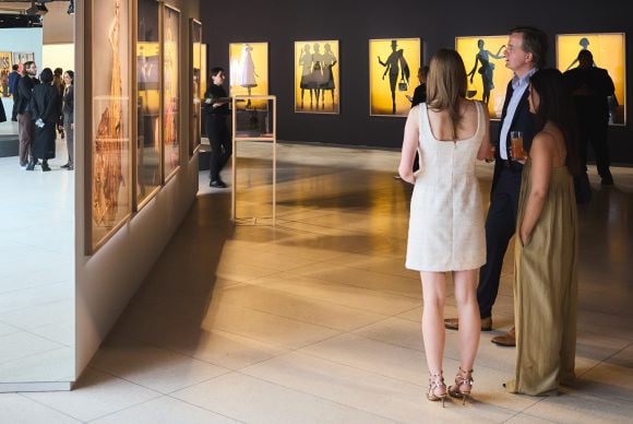 Attendees viewing Brigitte Niedermair’s photographic work, 35 commissioned pieces that provide a unique look at 80 years of Dior Couture