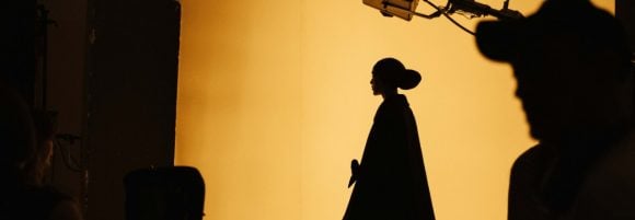 Women in silhouette with yellow lighting