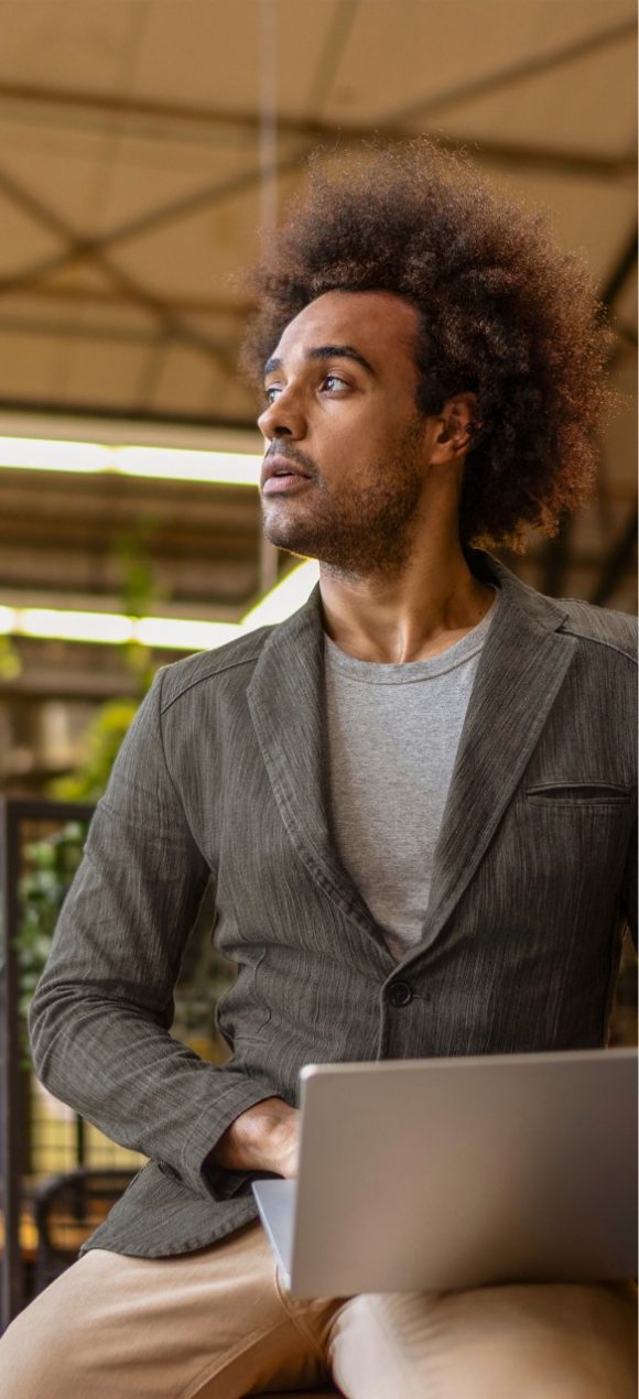 Customer working on a laptop and managing his account