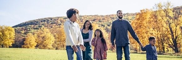 Family walking in landscape