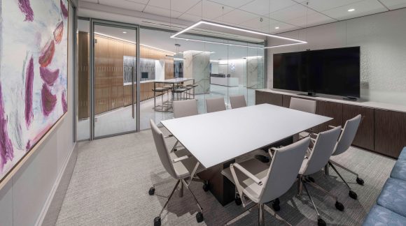 meeting room with a table, light and chairs