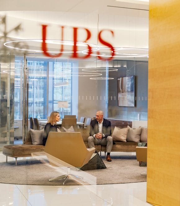 UBS Financial Advisor sitting with client in lobby