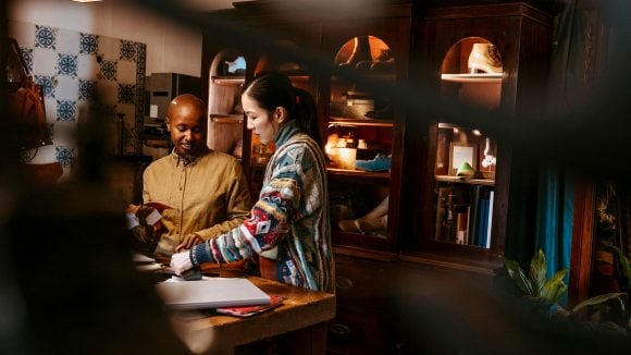 Two women working together.