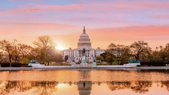 US Capitol at sunset, reflected in the water