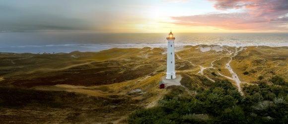 Wide-view of lighthouse at sunset